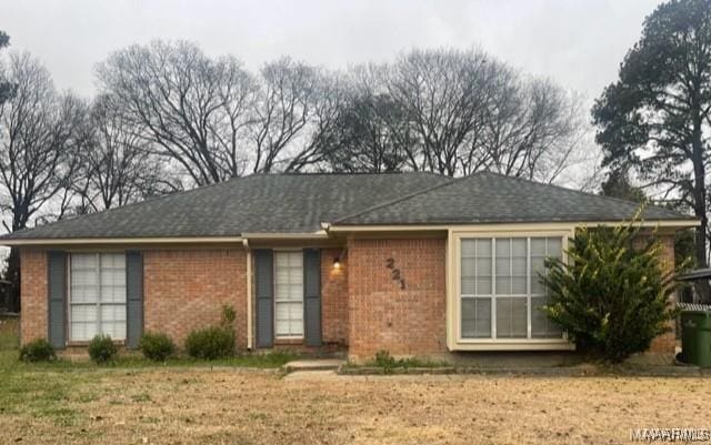 ranch-style home with a front yard