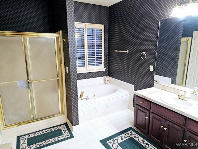 bathroom featuring vanity, tile patterned floors, and shower with separate bathtub