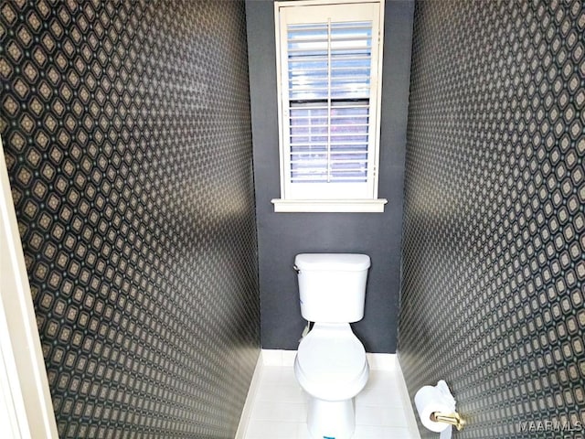 bathroom with tile patterned floors and toilet