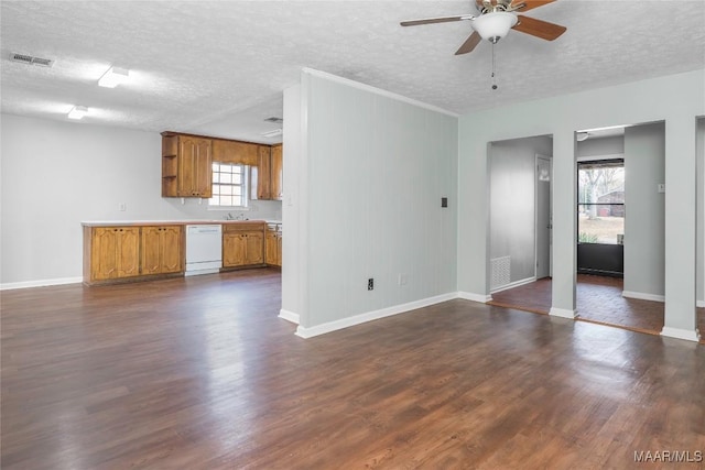 unfurnished living room with ceiling fan, a textured ceiling, and dark hardwood / wood-style flooring