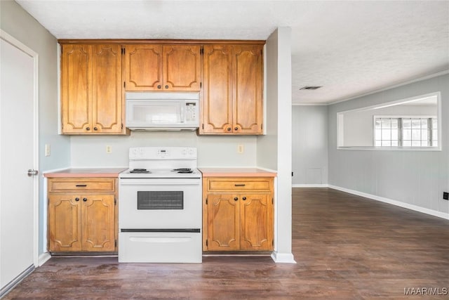 kitchen with dark hardwood / wood-style flooring, white appliances, crown molding, and a textured ceiling