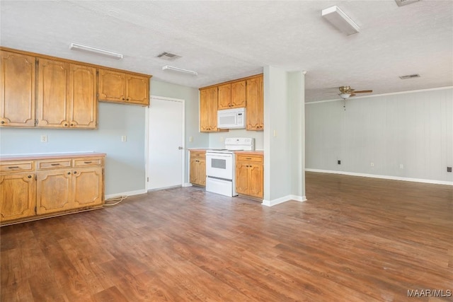 kitchen featuring ceiling fan, white appliances, dark hardwood / wood-style flooring, and a textured ceiling