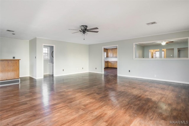 unfurnished living room featuring dark hardwood / wood-style flooring and ceiling fan