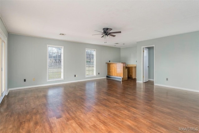 unfurnished living room featuring dark hardwood / wood-style floors and ceiling fan