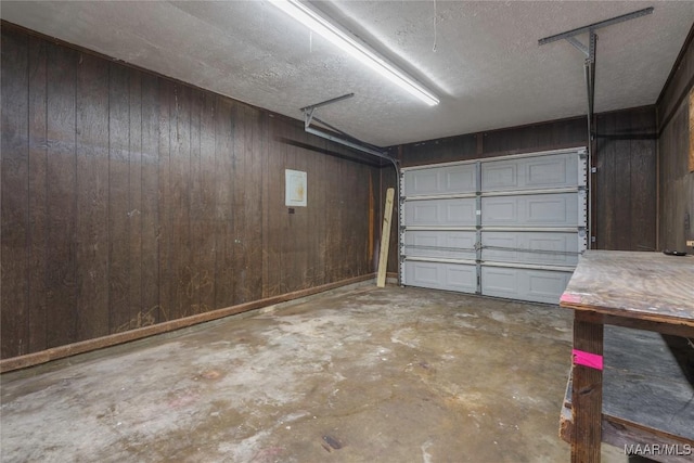 garage featuring wood walls