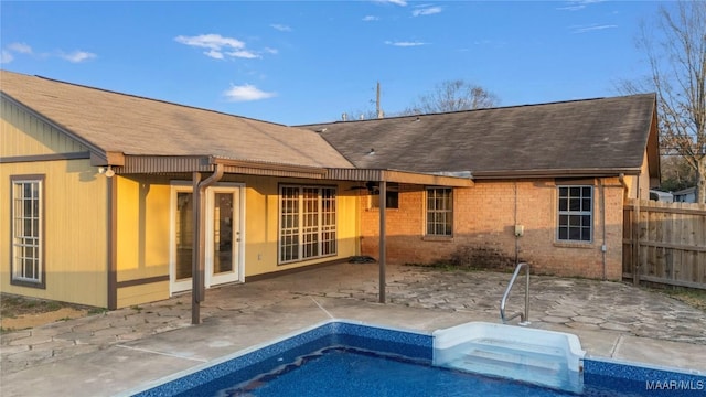 back of house with a patio