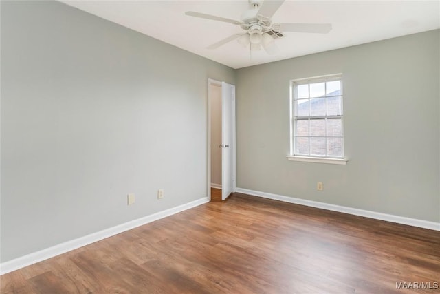 unfurnished room featuring hardwood / wood-style floors and ceiling fan