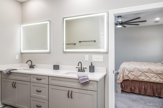 bathroom with ceiling fan and vanity