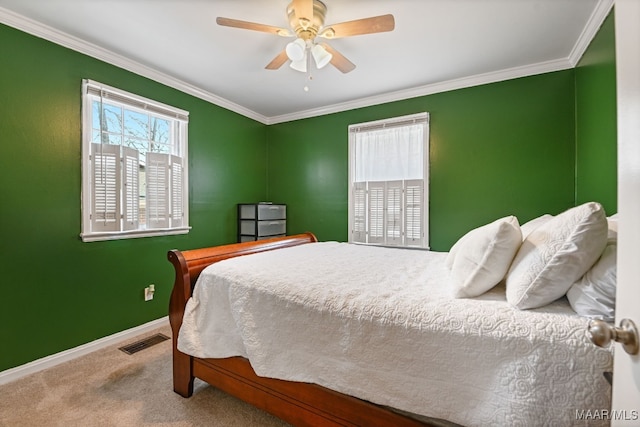 carpeted bedroom with crown molding and ceiling fan