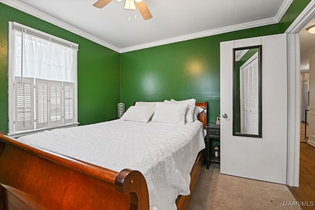 bedroom featuring ceiling fan and ornamental molding