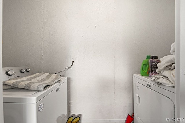 washroom featuring independent washer and dryer