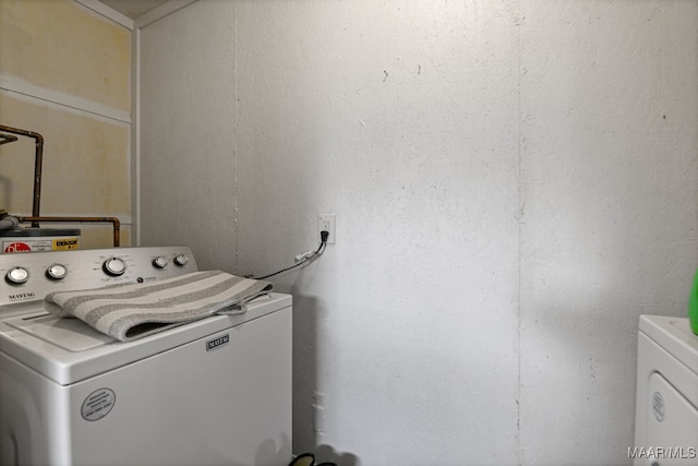 washroom with washer / clothes dryer