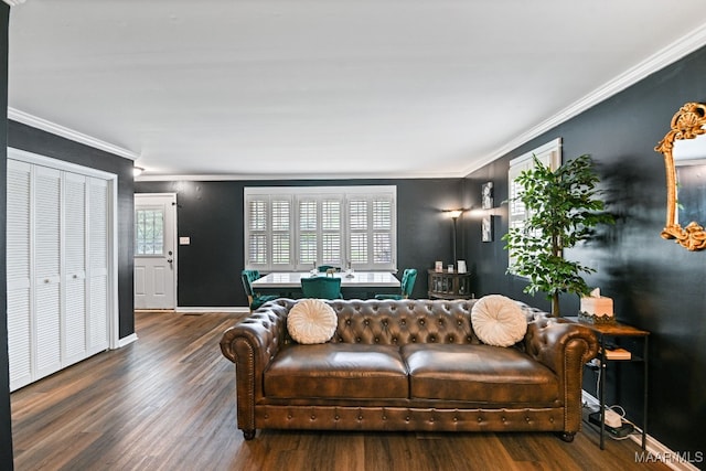 living room featuring ornamental molding and dark wood-type flooring