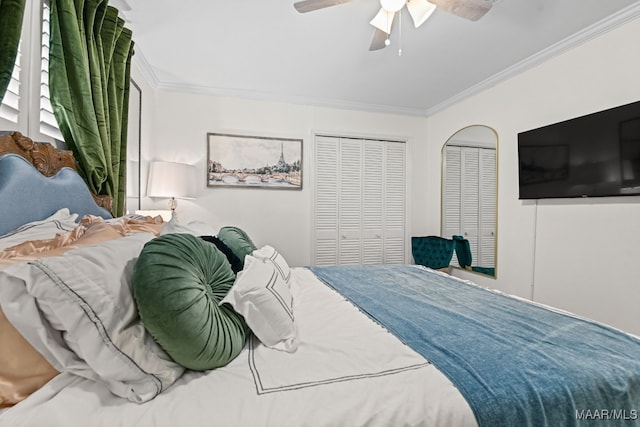 bedroom with ornamental molding, two closets, and ceiling fan