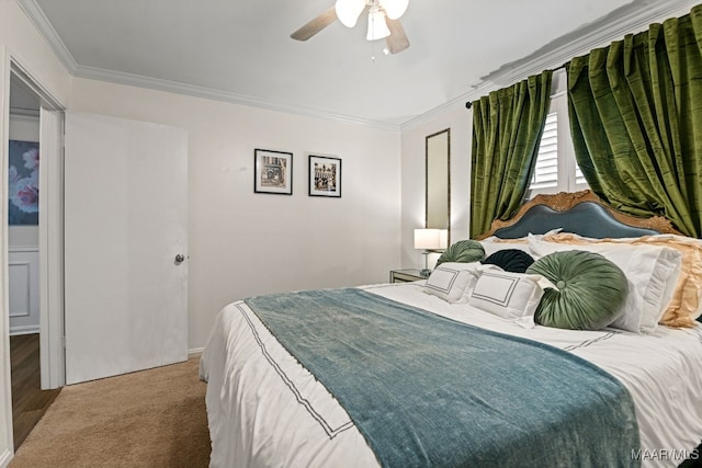 bedroom featuring carpet floors, ornamental molding, and ceiling fan