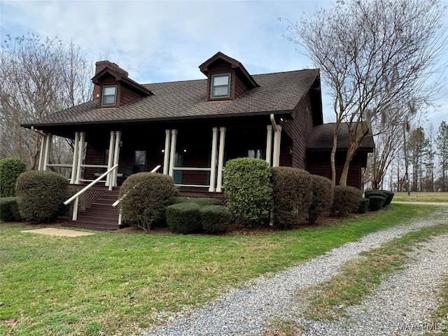 view of front facade featuring a porch and a front yard