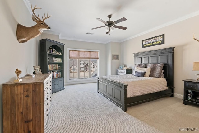 carpeted bedroom with crown molding and ceiling fan