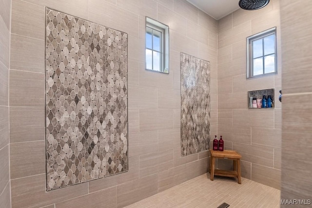 bathroom with tiled shower