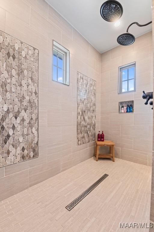 bathroom with a tile shower