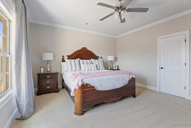 carpeted bedroom with crown molding and ceiling fan