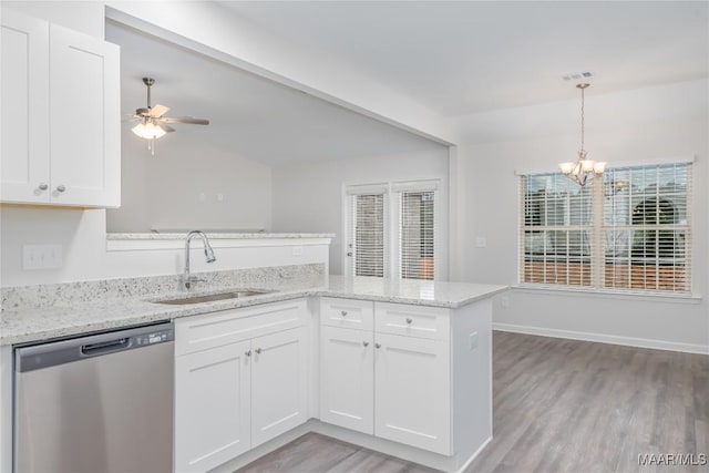 kitchen with white cabinetry, stainless steel dishwasher, sink, and pendant lighting