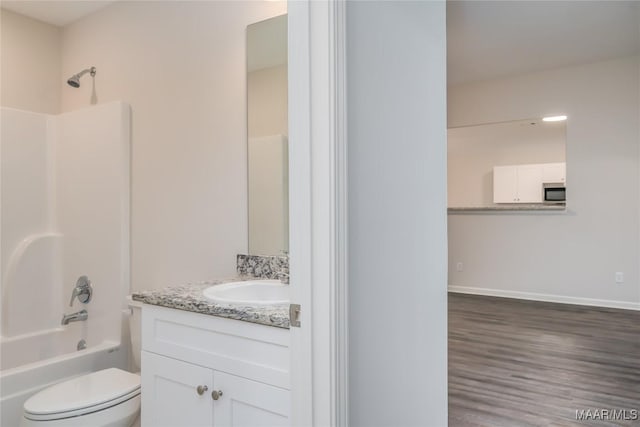 full bathroom with vanity, wood-type flooring, toilet, and shower / bathing tub combination