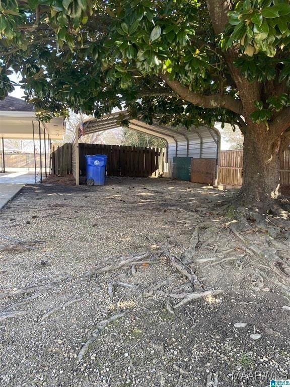 exterior space with a carport