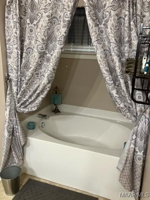 full bathroom featuring tile patterned flooring and a garden tub