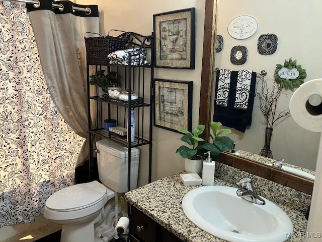 full bath with toilet and vanity