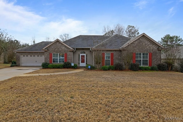 ranch-style house with a garage and a front lawn