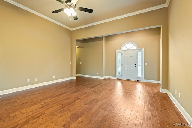 foyer featuring ceiling fan, ornamental molding, and wood-type flooring