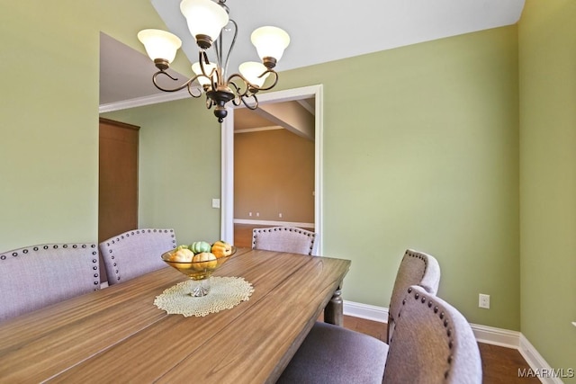 unfurnished dining area featuring ornamental molding and a notable chandelier