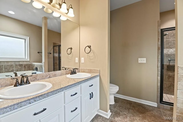 full bathroom featuring shower with separate bathtub, vanity, an inviting chandelier, and toilet