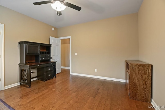 interior space featuring wood-type flooring and ceiling fan