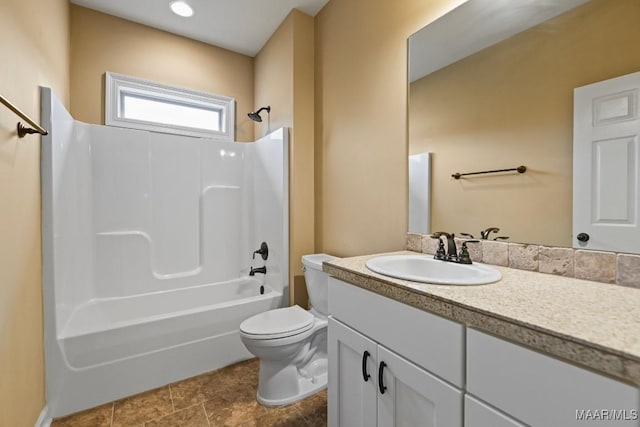 full bathroom featuring vanity, shower / tub combination, and toilet