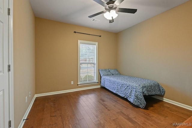 bedroom featuring hardwood / wood-style flooring and ceiling fan