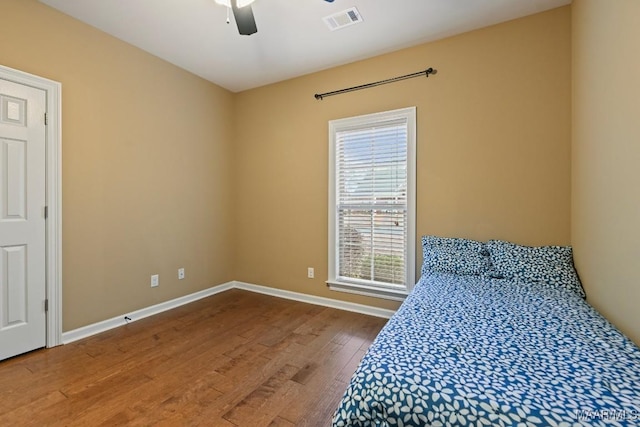 unfurnished bedroom featuring hardwood / wood-style flooring and ceiling fan