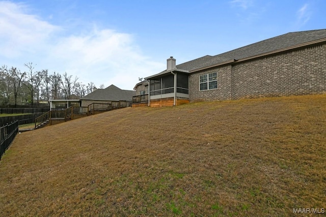 view of yard featuring a sunroom