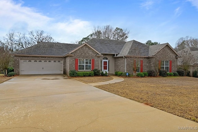 ranch-style house featuring a garage and a front lawn