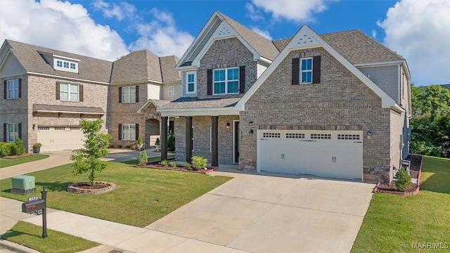 craftsman house featuring a garage, a porch, and a front yard