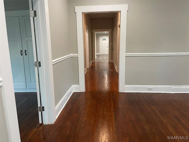 hall featuring dark wood-type flooring