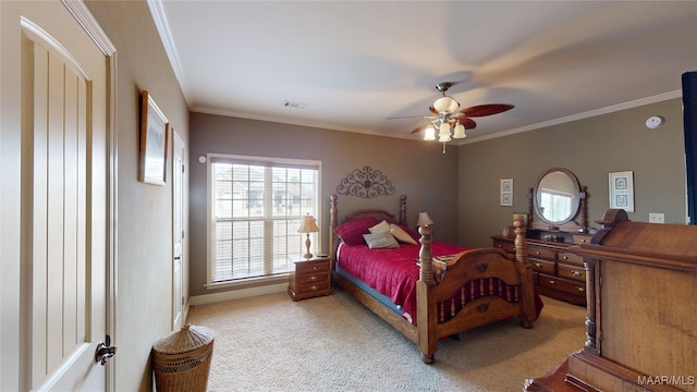 bedroom with visible vents, ornamental molding, ceiling fan, and light colored carpet