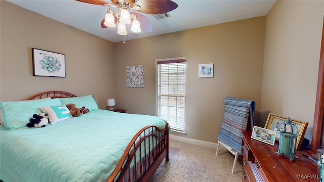 bedroom featuring carpet floors, visible vents, baseboards, and ceiling fan