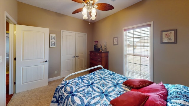 bedroom featuring a closet, carpet flooring, and ceiling fan