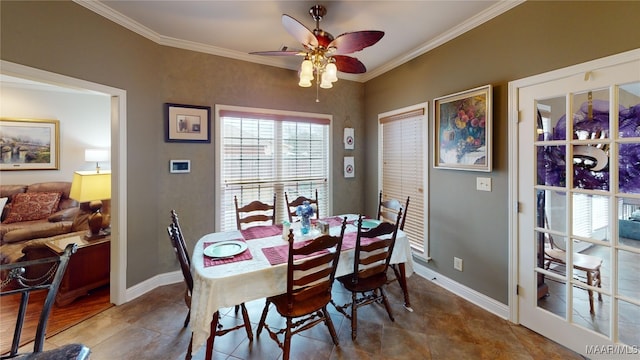 dining space with baseboards, a ceiling fan, and crown molding