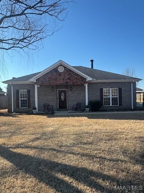 single story home with brick siding and a front yard