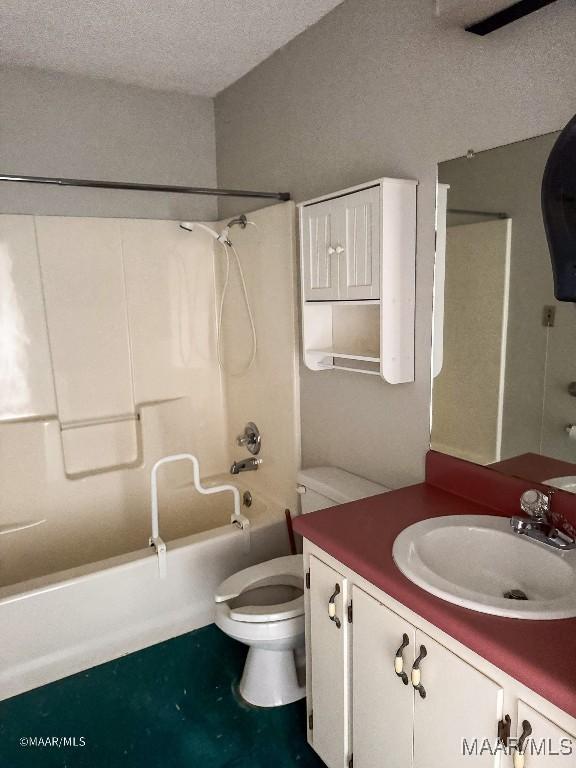 full bathroom with vanity, toilet, tub / shower combination, and a textured ceiling