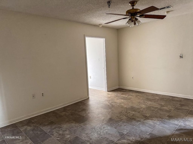 empty room featuring a textured ceiling and ceiling fan