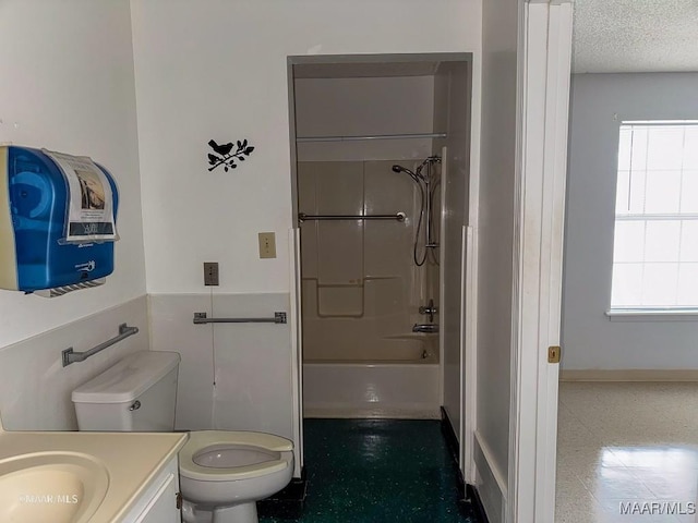 full bathroom featuring vanity, shower / bathing tub combination, a textured ceiling, and toilet