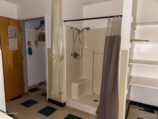 bathroom with a shower with shower curtain